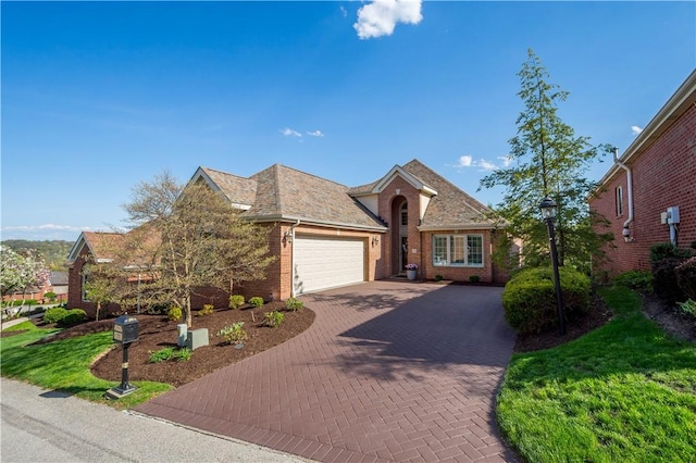 205 Prestonwood Ln, Peters Twp, PA 15317 - ranch-style house with brick siding, an attached garage, and decorative driveway