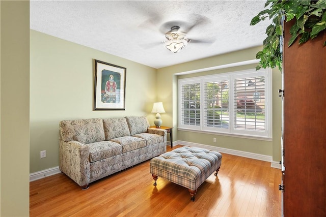 205 Prestonwood Ln, Peters Twp, PA 15317 - sitting room with wood-type flooring, a textured ceiling, baseboards, and ceiling fan