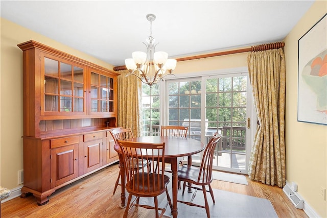 205 Prestonwood Ln, Peters Twp, PA 15317 - dining room featuring an inviting chandelier, baseboards, light wood-style floors, and visible vents