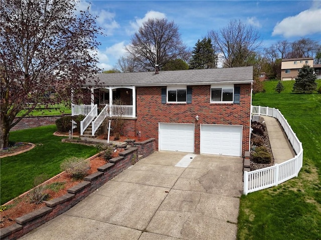 view of front of house featuring an attached garage, concrete driveway, a front lawn, and brick siding