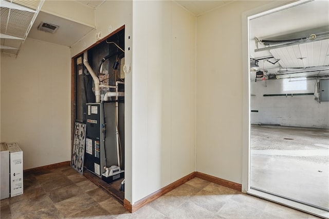 interior space featuring baseboards and visible vents