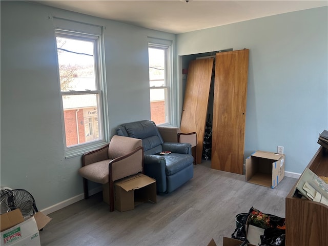 403 E 2nd Ave, Tarentum, PA 15084 - living area featuring baseboards and wood finished floors