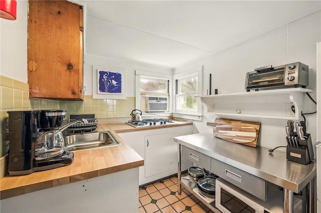 875 Hillside Rd, Jamestown Cra, PA 16134 - kitchen with tasteful backsplash, a sink, butcher block countertops, a toaster, and gas stovetop