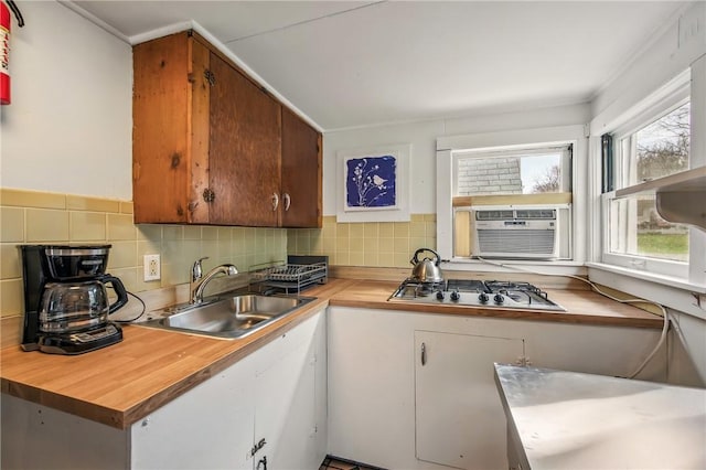 875 Hillside Rd, Jamestown Cra, PA 16134 - kitchen with a sink, stainless steel gas cooktop, backsplash, and white cabinets