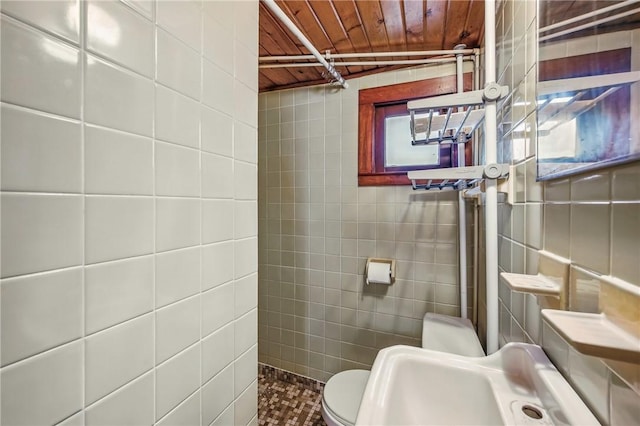 875 Hillside Rd, Jamestown Cra, PA 16134 - bathroom featuring tile walls, wood ceiling, and toilet