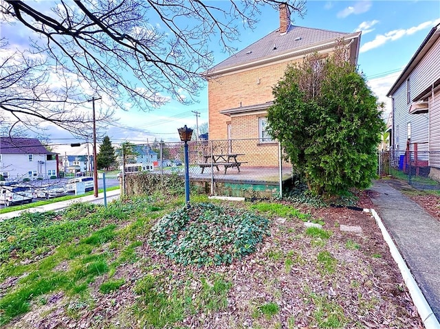 view of community featuring fence