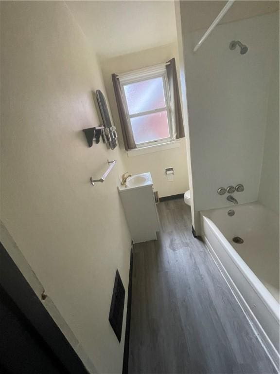 119-121 Giffin Ave, Mount Oliver, PA 15210 - full bathroom with wood finished floors, toilet, tub / shower combination, and vanity