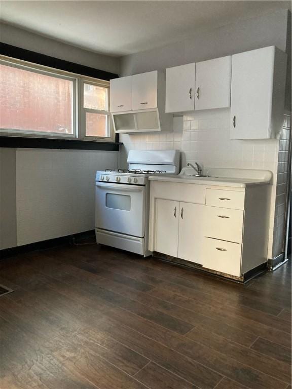 119-121 Giffin Ave, Mount Oliver, PA 15210 - kitchen featuring white gas range, light countertops, dark wood-style floors, and white cabinets