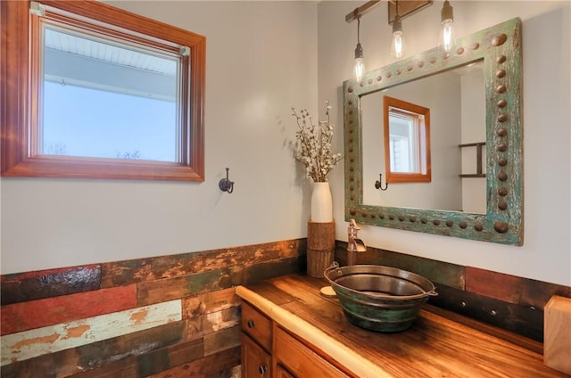 bathroom with vanity and plenty of natural light
