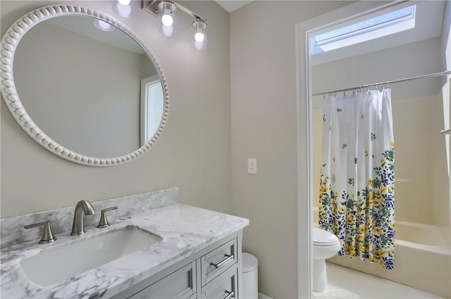 bathroom featuring toilet, shower / bath combo, and vanity