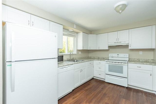 kitchen featuring white appliances, light countertops, white cabinetry, under cabinet range hood, and a sink