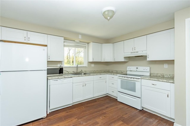 kitchen with white appliances, white cabinetry, under cabinet range hood, and a sink