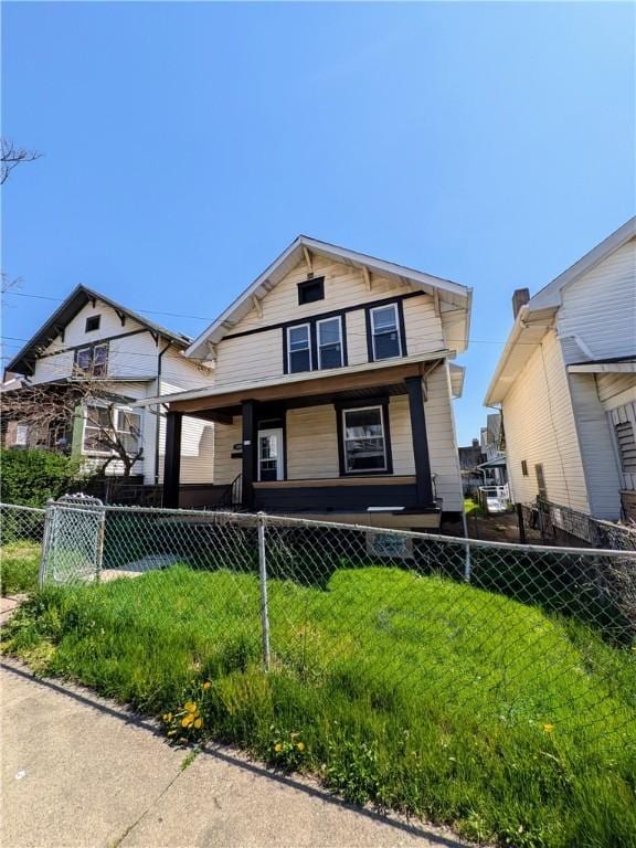 108 Mccandless St, Arnold, PA 15068 - view of front of house with a porch, fence private yard, and a front yard