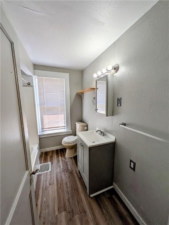 108 Mccandless St, Arnold, PA 15068 - full bathroom featuring vanity, visible vents, wood finished floors, toilet, and baseboards