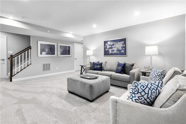 living room featuring visible vents, stairway, baseboards, carpet flooring, and recessed lighting