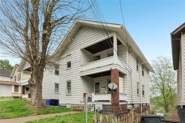 715-717 Hiland Ave, Coraopolis, PA 15108 - view of front of property featuring a balcony and a front lawn