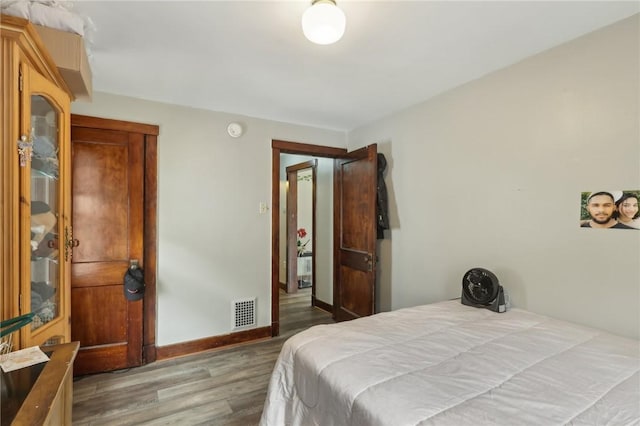 715-717 Hiland Ave, Coraopolis, PA 15108 - bedroom with baseboards, wood finished floors, and visible vents