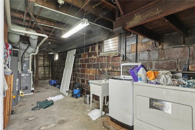 715-717 Hiland Ave, Coraopolis, PA 15108 - unfinished basement featuring independent washer and dryer, heating unit, a sink, and water heater