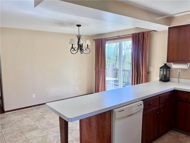 kitchen with an inviting chandelier, dishwasher, light countertops, a peninsula, and decorative light fixtures