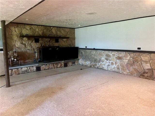 2144 Highland Dr, Summit Twp But, PA 16002 - unfurnished living room with a stone fireplace, carpet flooring, and a textured ceiling