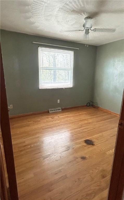 2144 Highland Dr, Summit Twp But, PA 16002 - spare room with light wood-type flooring, baseboards, and visible vents
