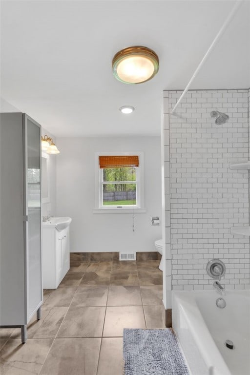 bathroom with visible vents, tile patterned flooring, shower / tub combination, vanity, and toilet