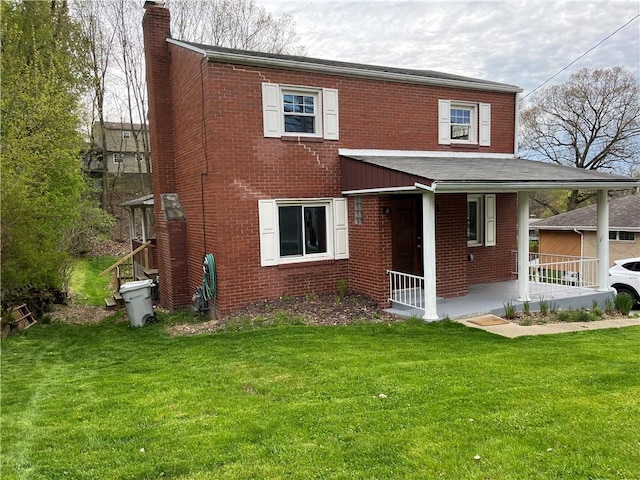 611 W Sutter Rd, Shaler, PA 15116 - view of front facade featuring a chimney, a porch, a front lawn, and brick siding