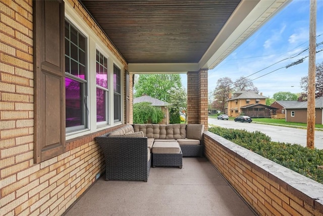 view of patio featuring a porch and outdoor lounge area