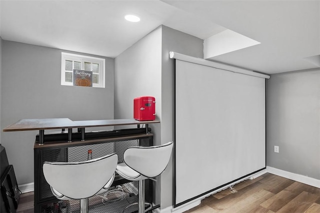 office space with recessed lighting, baseboards, and wood finished floors