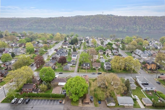 bird's eye view featuring a view of trees and a residential view