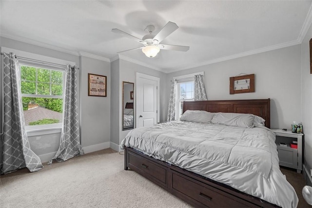 bedroom featuring baseboards, ornamental molding, a ceiling fan, and light colored carpet