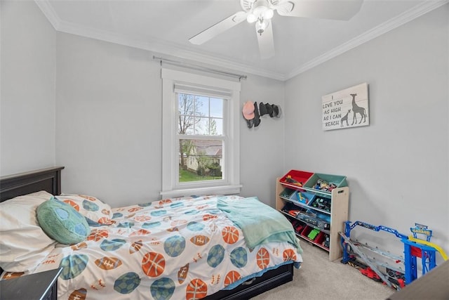 carpeted bedroom featuring ornamental molding and a ceiling fan