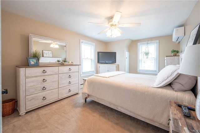 bedroom with an AC wall unit, ceiling fan, and light carpet
