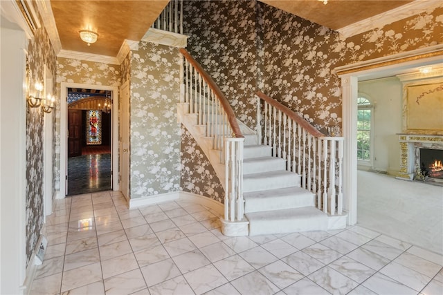107 Treetop Ln, Peters Twp, PA 15317 - stairway featuring a premium fireplace, wallpapered walls, ornamental molding, and marble finish floor