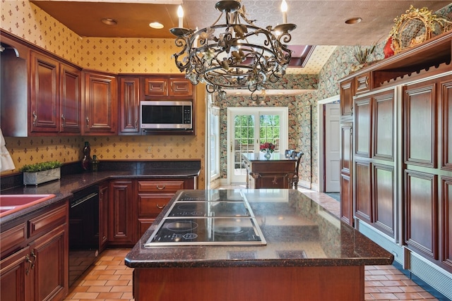 107 Treetop Ln, Peters Twp, PA 15317 - kitchen with a kitchen island, wallpapered walls, black appliances, a chandelier, and recessed lighting