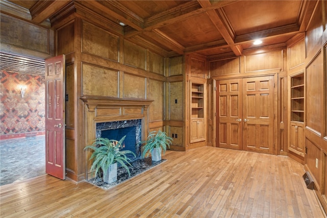 107 Treetop Ln, Peters Twp, PA 15317 - unfurnished living room featuring wood ceiling, light wood finished floors, wooden walls, and built in shelves