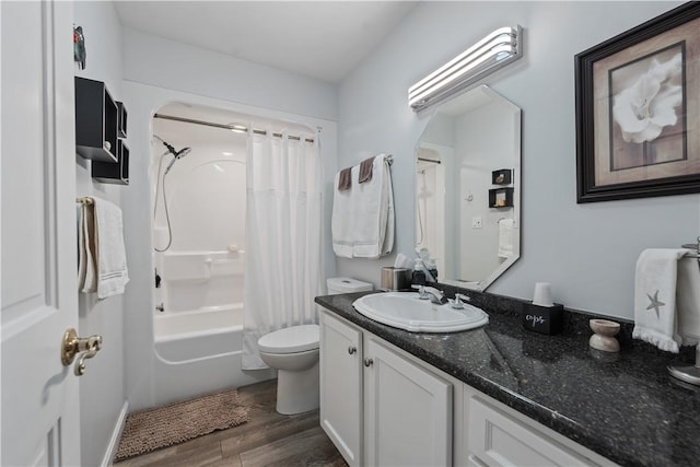 bathroom featuring vanity, shower / bath combo with shower curtain, toilet, and wood finished floors