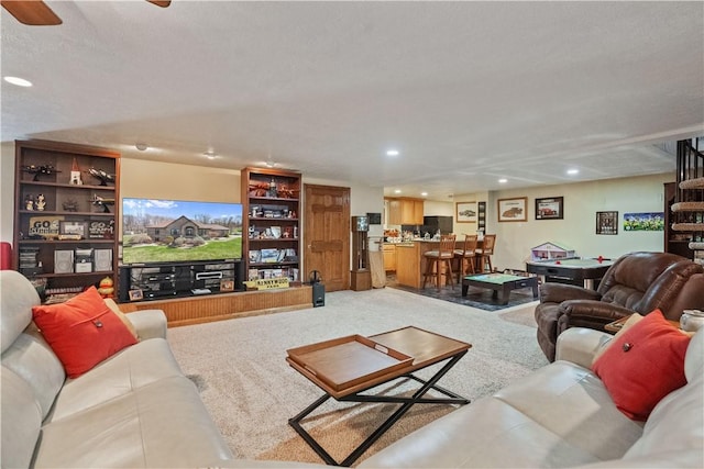 living room with recessed lighting, ceiling fan, and carpet
