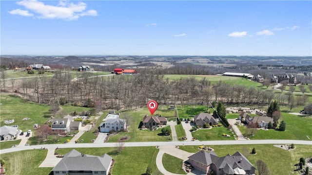 birds eye view of property with a residential view