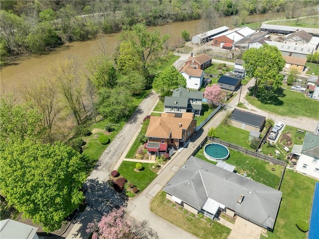 bird's eye view with a residential view and a water view