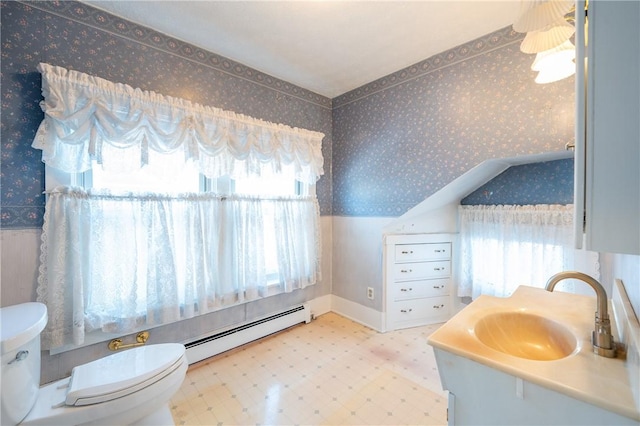 bathroom with vanity, toilet, wallpapered walls, tile patterned floors, and a baseboard radiator