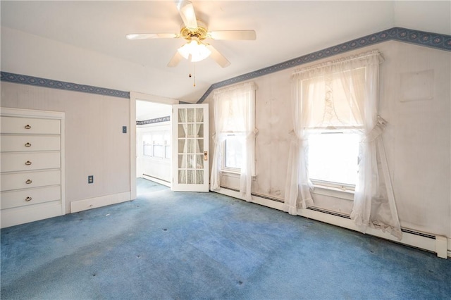 empty room featuring ceiling fan, carpet flooring, and lofted ceiling