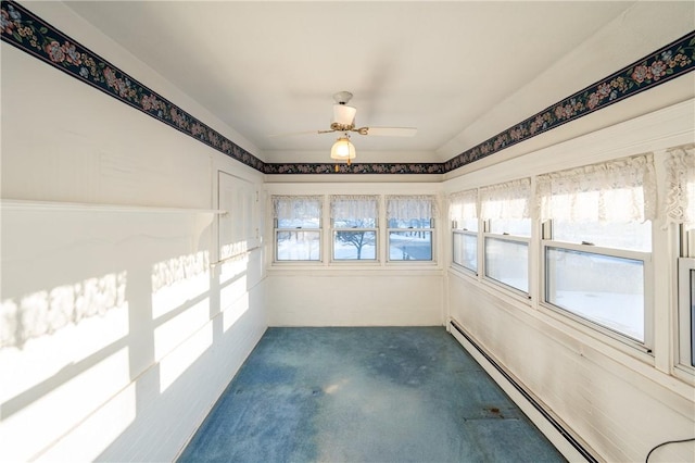 unfurnished sunroom with plenty of natural light, carpet floors, ceiling fan, and baseboard heating