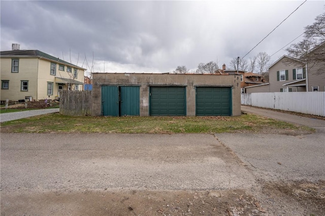 detached garage with fence