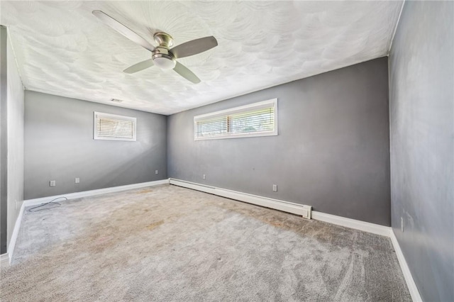 144 Harmony St, Connoquenessing Boro, PA 16027 - carpeted empty room featuring baseboards, a baseboard radiator, a textured ceiling, and a ceiling fan