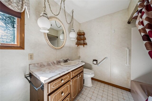 144 Harmony St, Connoquenessing Boro, PA 16027 - full bathroom featuring vanity, tile patterned floors, toilet, and a washtub