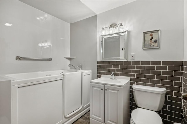 116 Thornberry Dr, Churchill Boro, PA 15235 - bathroom with a garden tub, vanity, and tile walls