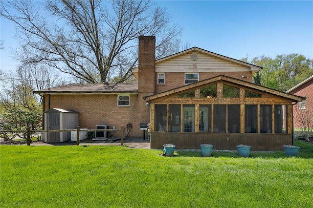 116 Thornberry Dr, Churchill Boro, PA 15235 - rear view of house featuring a sunroom, a chimney, brick siding, and a shed