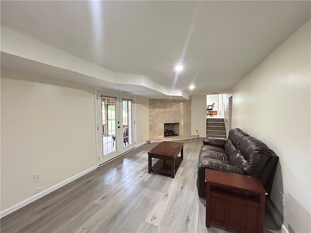 116 Thornberry Dr, Churchill Boro, PA 15235 - living area featuring wood finished floors, a fireplace, stairs, and french doors