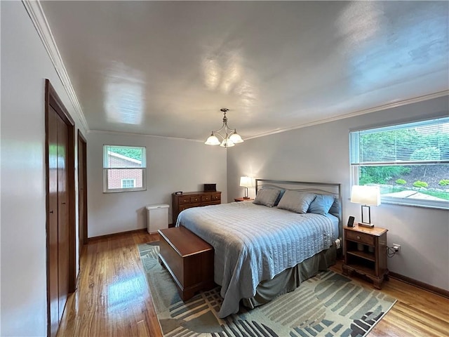 116 Thornberry Dr, Churchill Boro, PA 15235 - bedroom with crown molding, a chandelier, light wood-style flooring, and multiple windows
